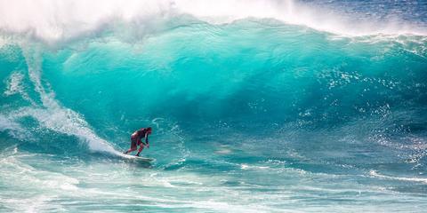 person surfing a big wave off the coastline of Mozambique