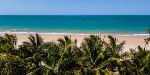 Inhassoro beach and palm trees overlooking the ocean