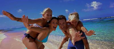 a family of four on the beach