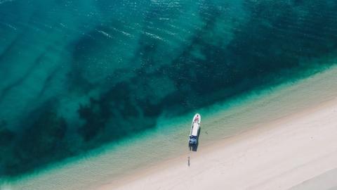 aerial view of a boat in the ocean